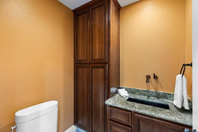 a bathroom with a sink a mirror and a shower