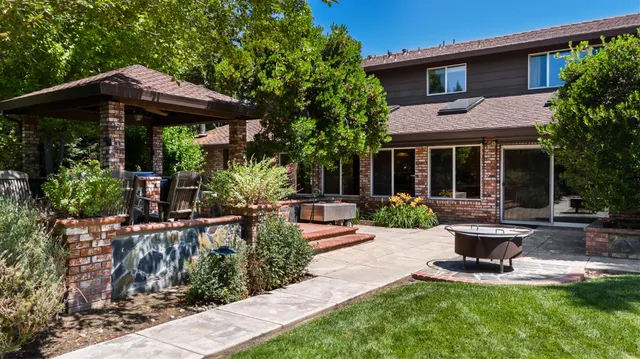 a bathroom with a sink double vanity granite and a mirror