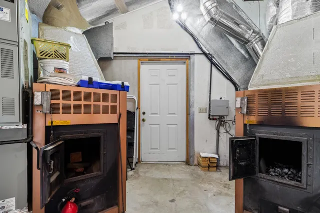 an aerial view of a house with a garden and lake view