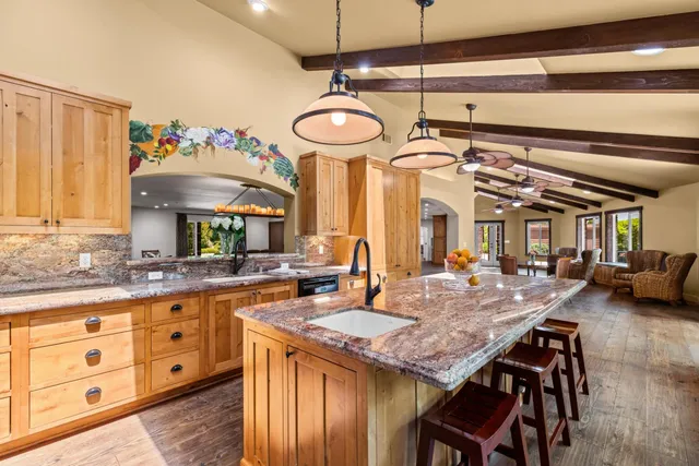 a view of a livingroom with furniture window and wooden floor