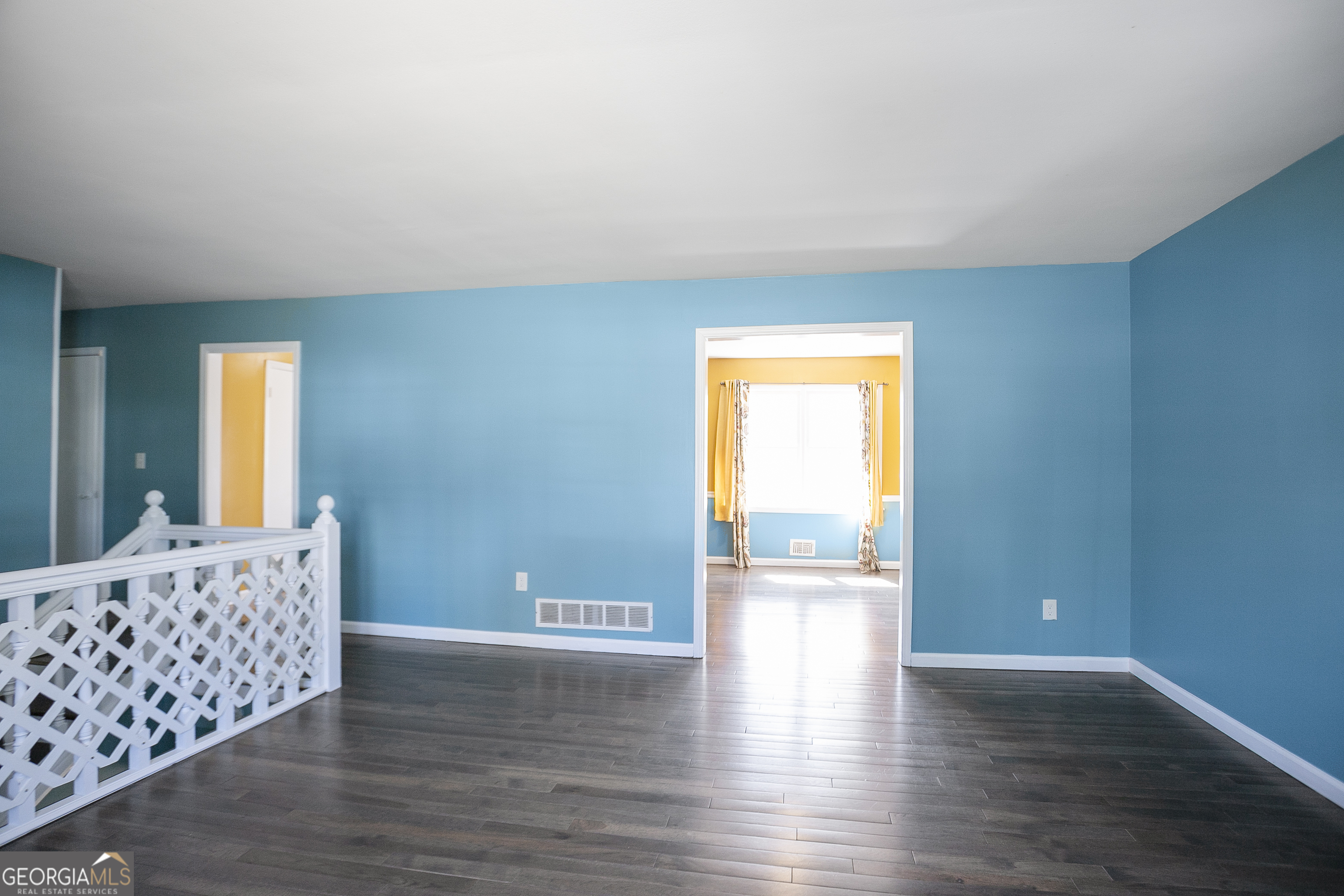 3959 Emerald Springs Court, Unit 3 Decatur, GA 30035 - Photo 12 of 27 a view of an empty room with window and wooden floor