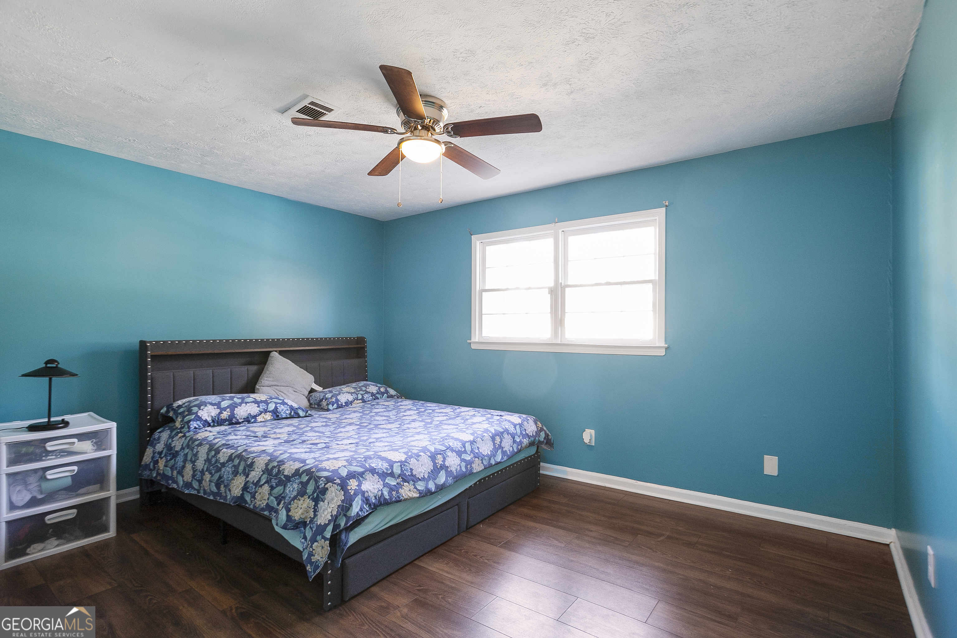 3959 Emerald Springs Court, Unit 3 Decatur, GA 30035 - Photo 23 of 27 a bedroom with a bed and window