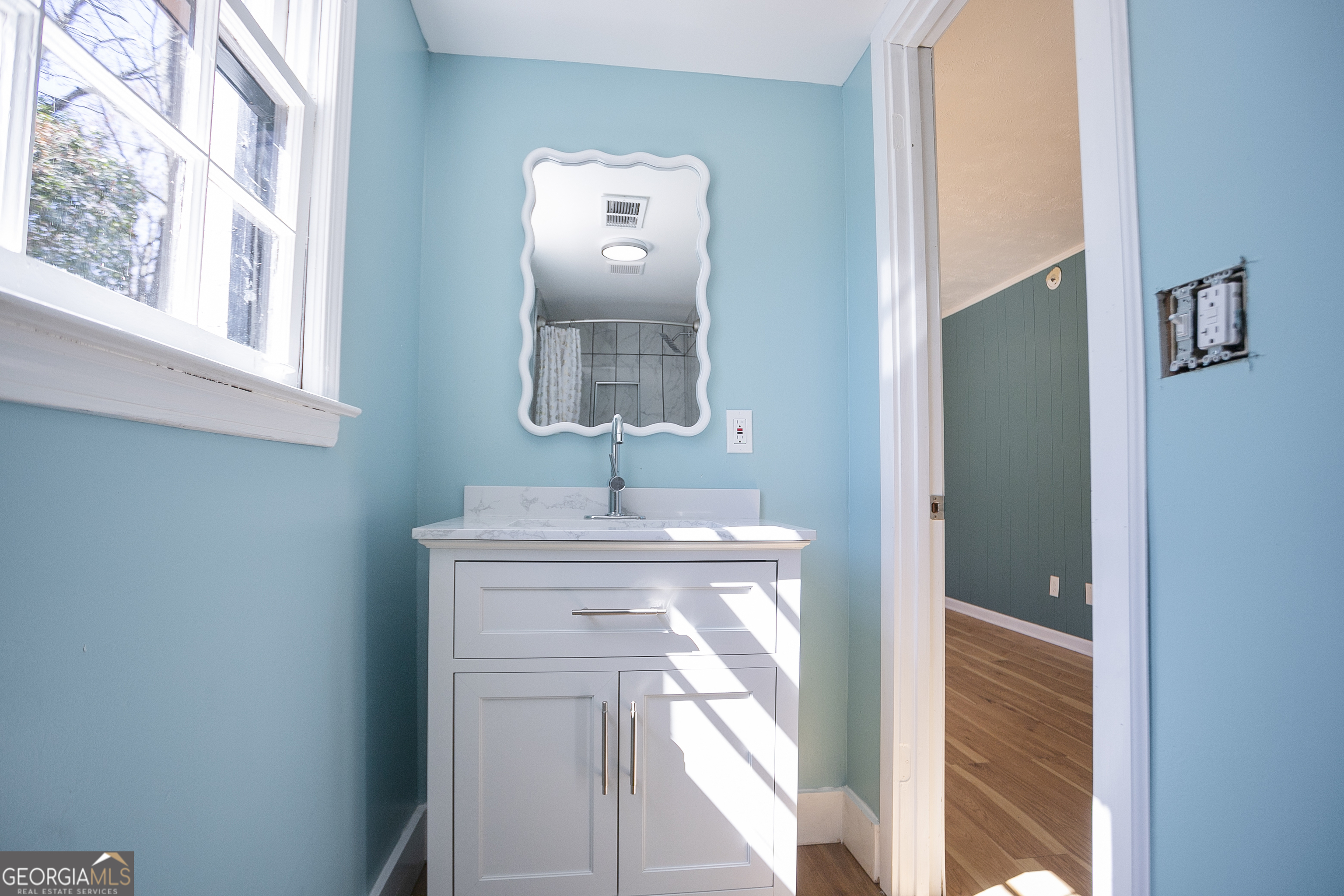 3959 Emerald Springs Court, Unit 3 Decatur, GA 30035 - Photo 27 of 27 a bathroom with a sink mirror and a vanity