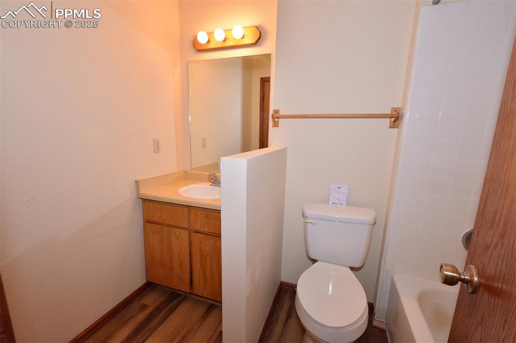 1021 Dublin Boulevard Colorado Springs, CO 80918 - Photo 13 of 20 a white toilet sitting next to a bathroom sink