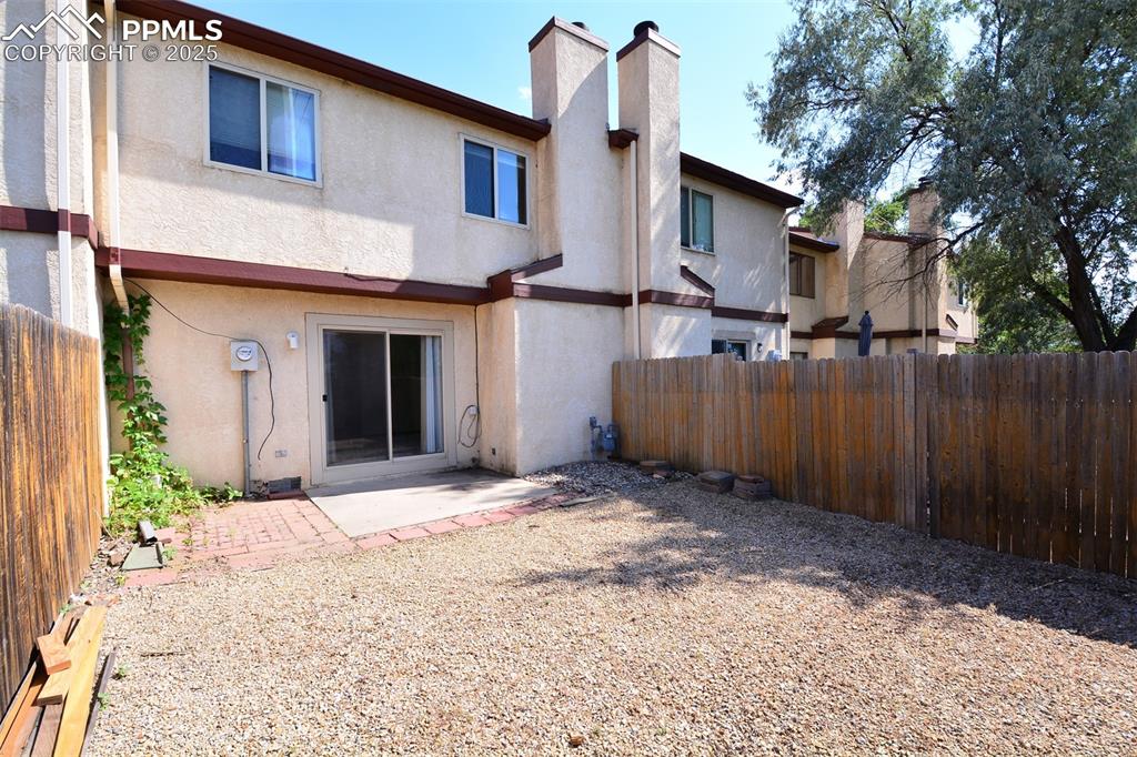 1021 Dublin Boulevard Colorado Springs, CO 80918 - Photo 17 of 20 a view of a house with a wooden fence
