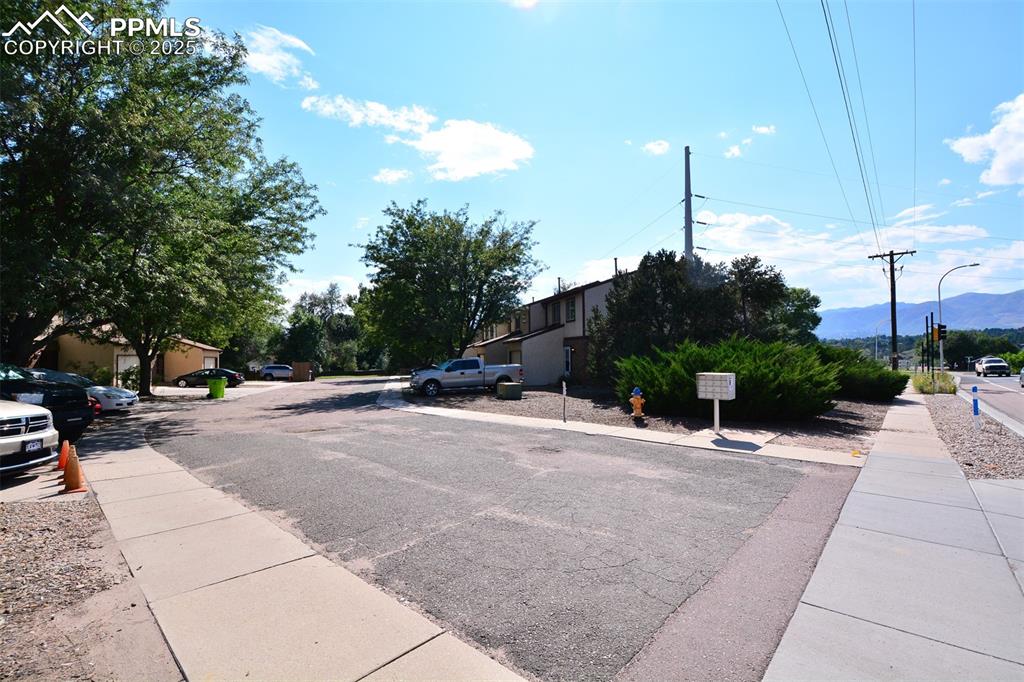 1021 Dublin Boulevard Colorado Springs, CO 80918 - Photo 19 of 20 a view of a street with a building in the background