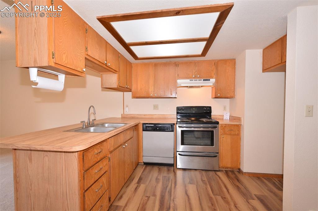 1021 Dublin Boulevard Colorado Springs, CO 80918 - Photo 4 of 20 a kitchen with a stove and a sink