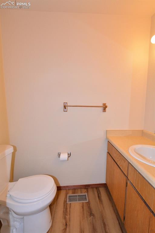 1021 Dublin Boulevard Colorado Springs, CO 80918 - Photo 9 of 20 a bathroom with a toilet and a sink