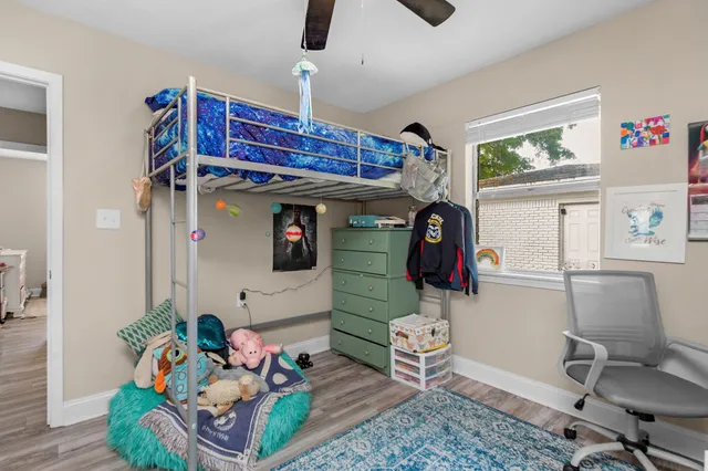 a room with furniture and wooden floor