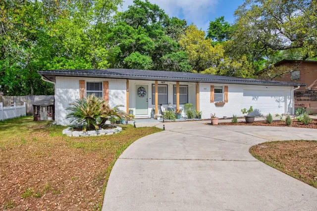a view of a backyard with a patio