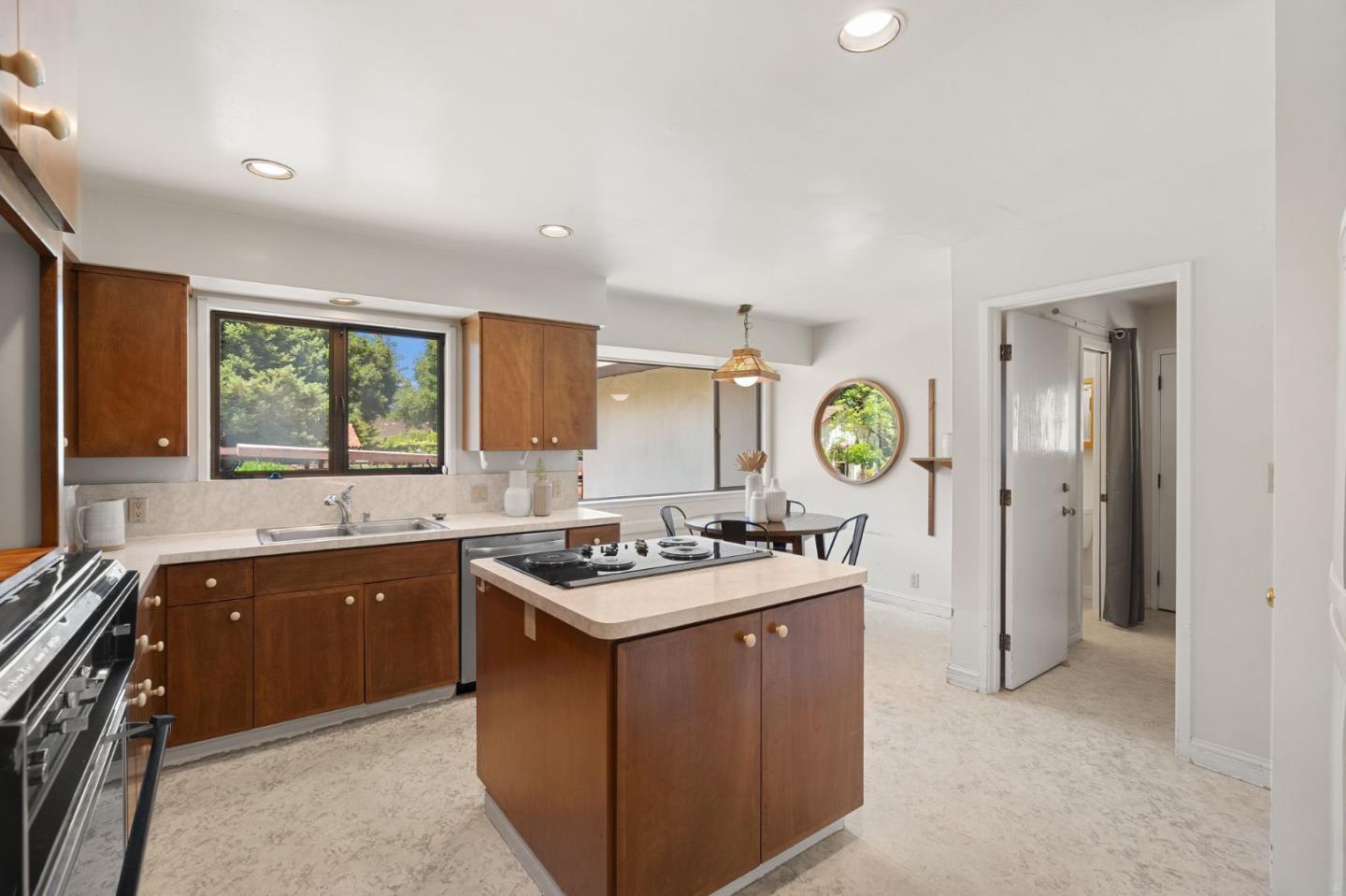 17 Oak Street Los Altos, CA 94022 - Photo 4 of 9 a kitchen with a sink stove and cabinets