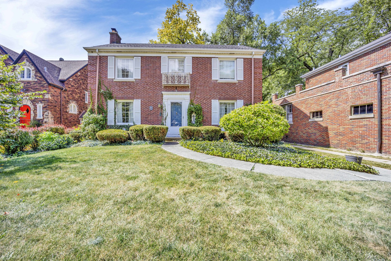 410 Audubon Road Riverside, IL 60546 - Photo 1 of 31 a front view of a house with garden