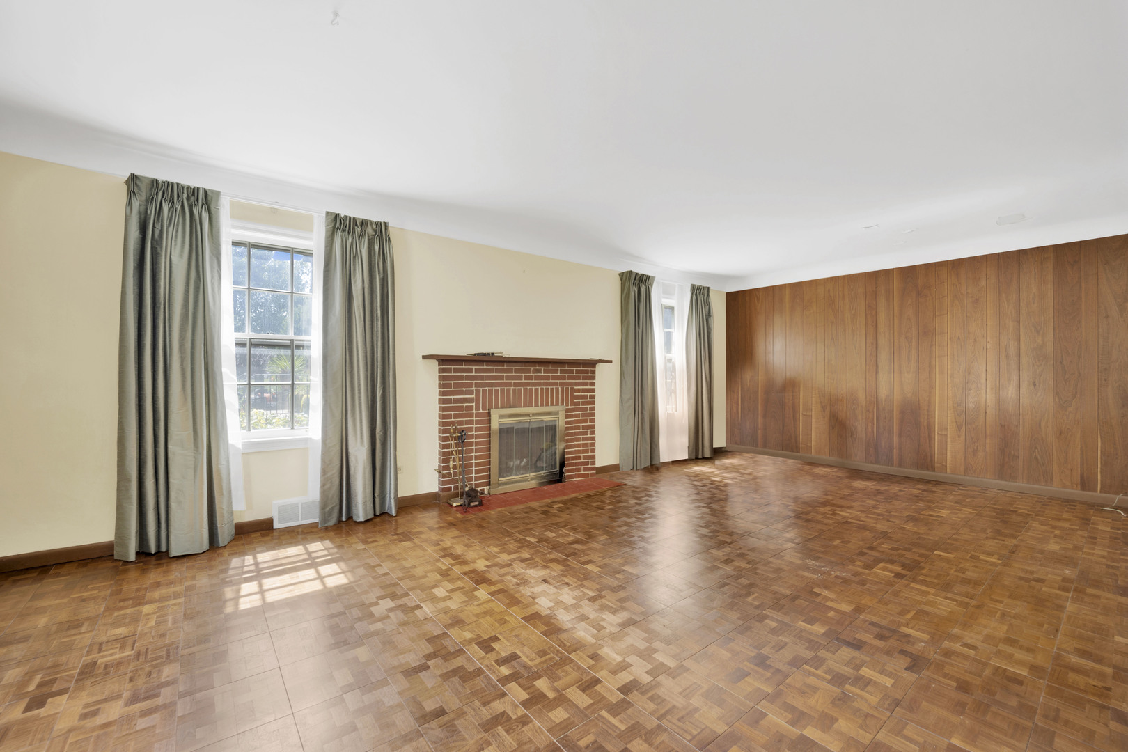 410 Audubon Road Riverside, IL 60546 - Photo 3 of 31 an empty room with windows and fireplace