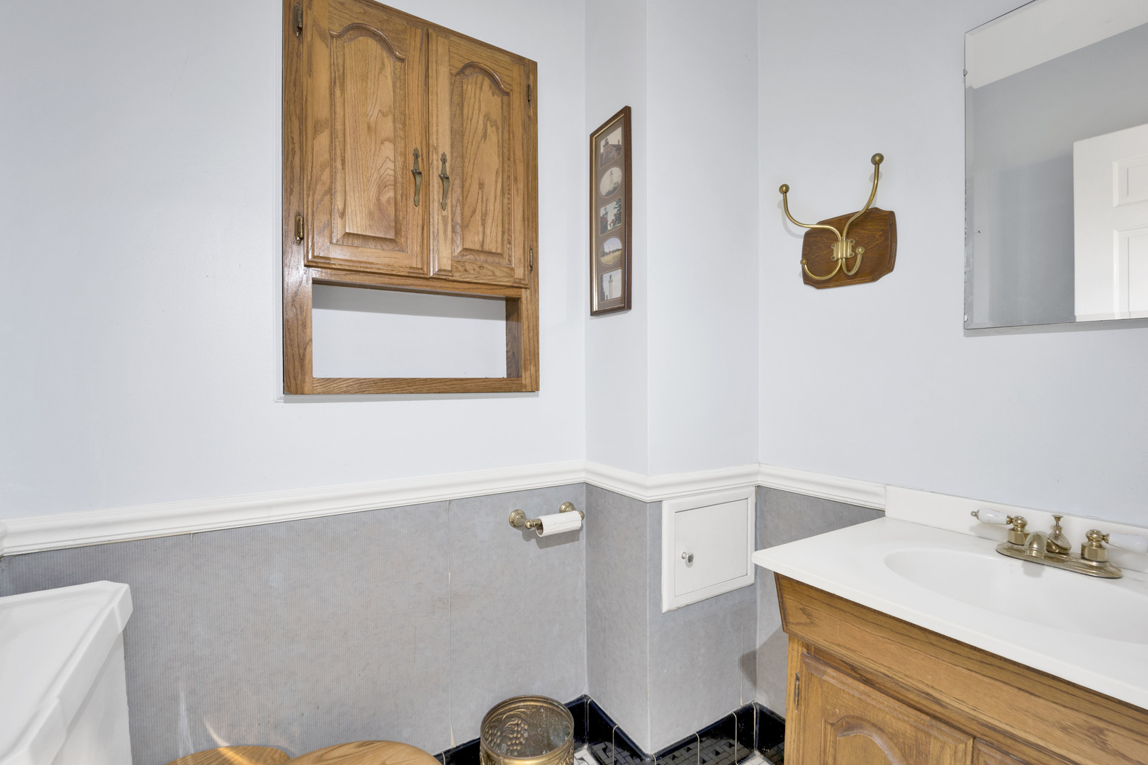 410 Audubon Road Riverside, IL 60546 - Photo 8 of 31 a bathroom with a sink a mirror and a window