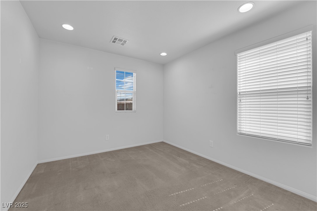 9205 Keystone Ridge Avenue Las Vegas, NV 89148 - Photo 19 of 40 Carpeted spare room featuring recessed lighting