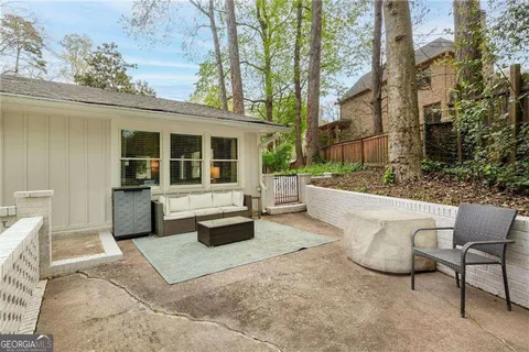 a view of a patio with a chairs and table in a patio