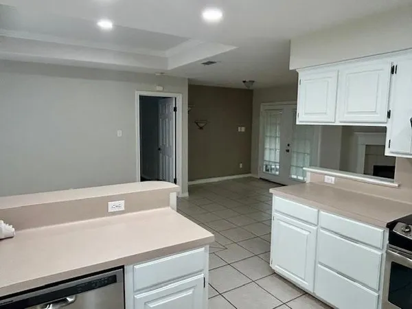 a kitchen with a sink and cabinets