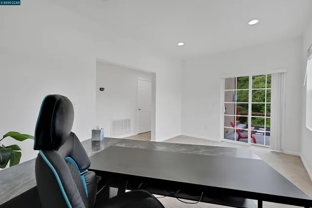 a view of a workspace with furniture