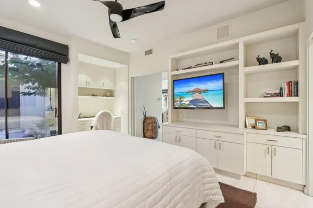 a large white bed in a white room