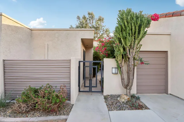 a sign that is sitting in front of a house