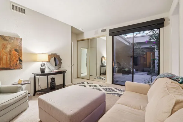 a living room with furniture and a large window