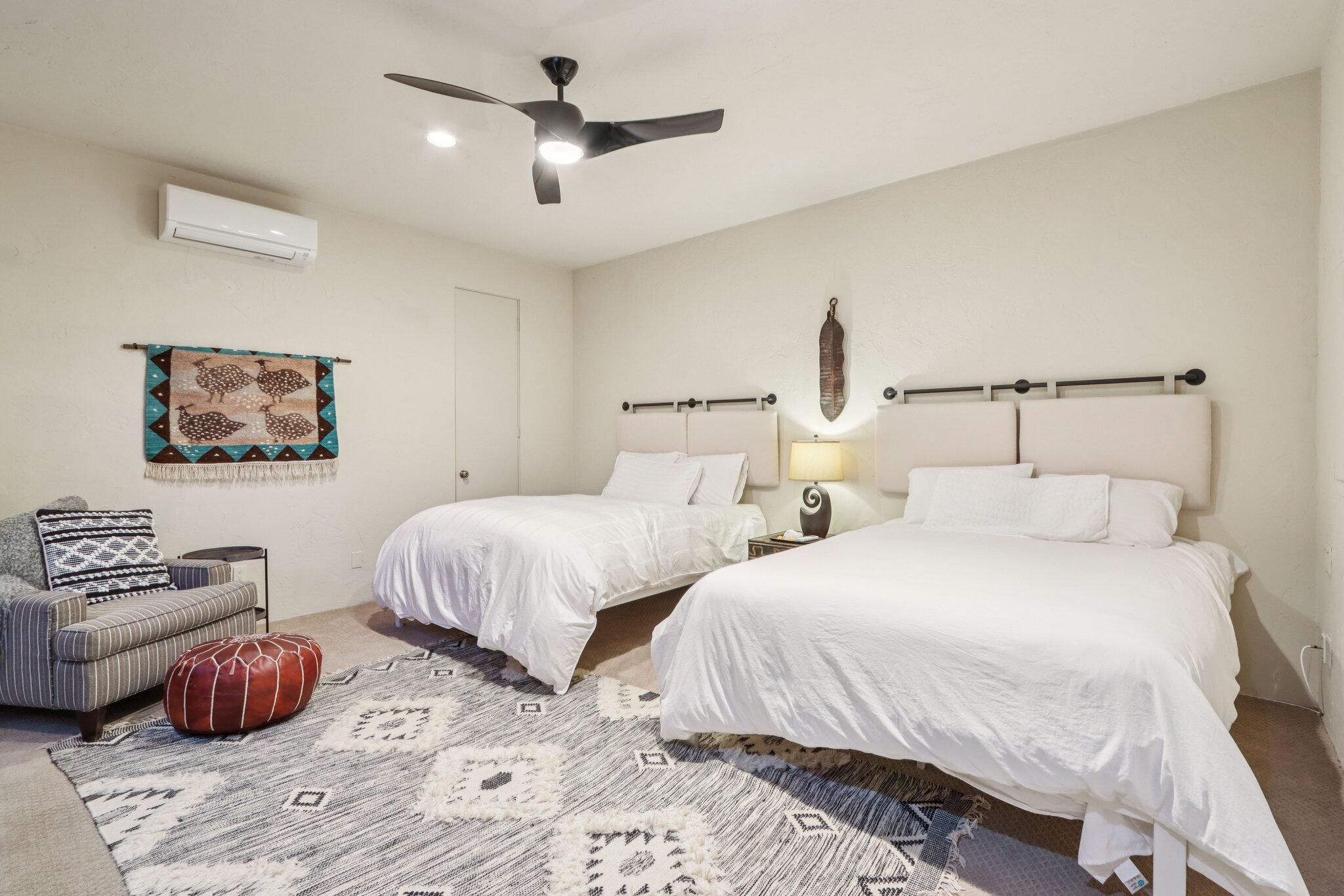 829 Inverness Drive Rancho Mirage, CA 92270 - Photo 21 of 27 a bedroom with two beds and painting on the wall