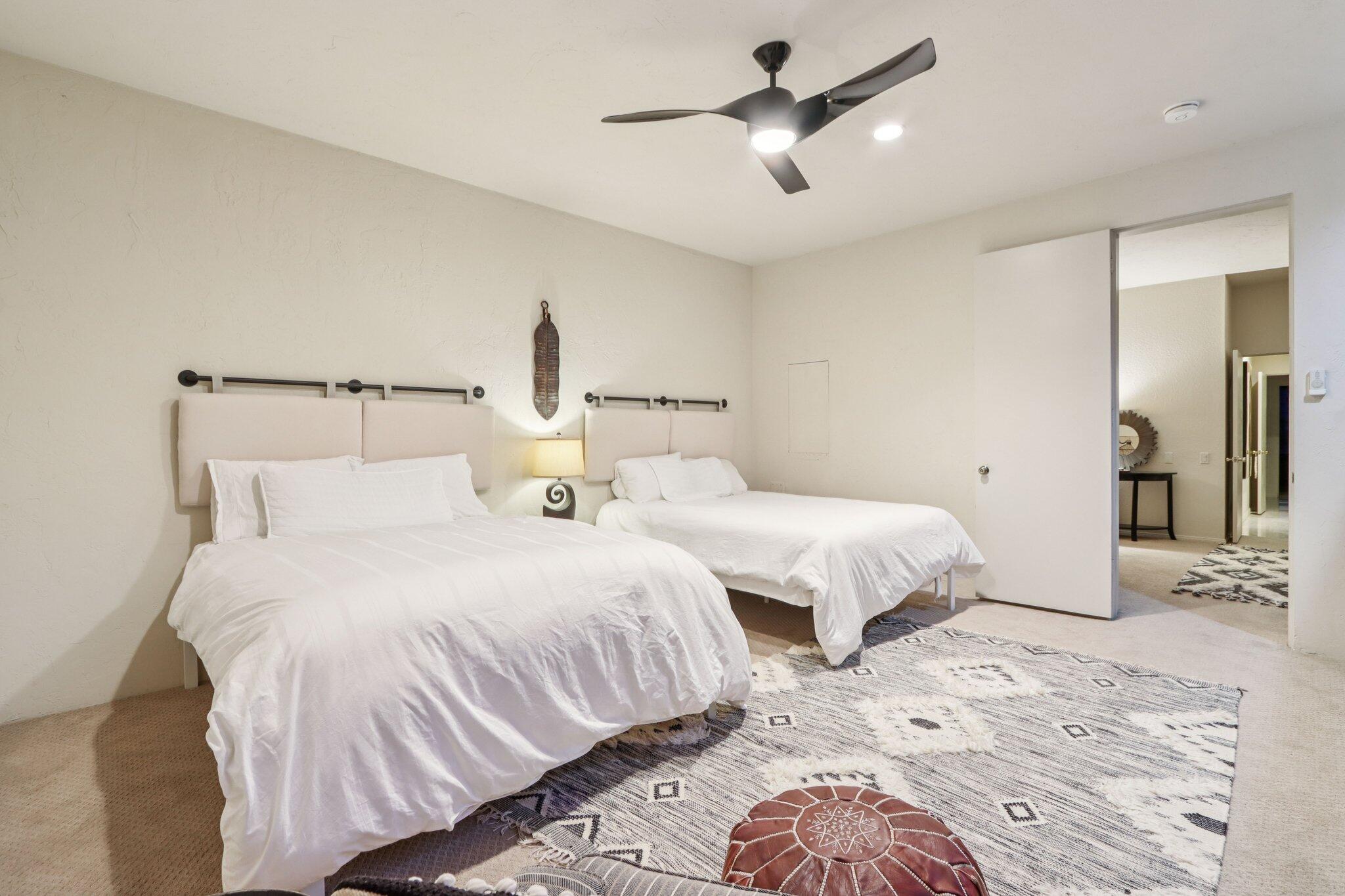 829 Inverness Drive Rancho Mirage, CA 92270 - Photo 22 of 27 a bedroom with two beds and white walls