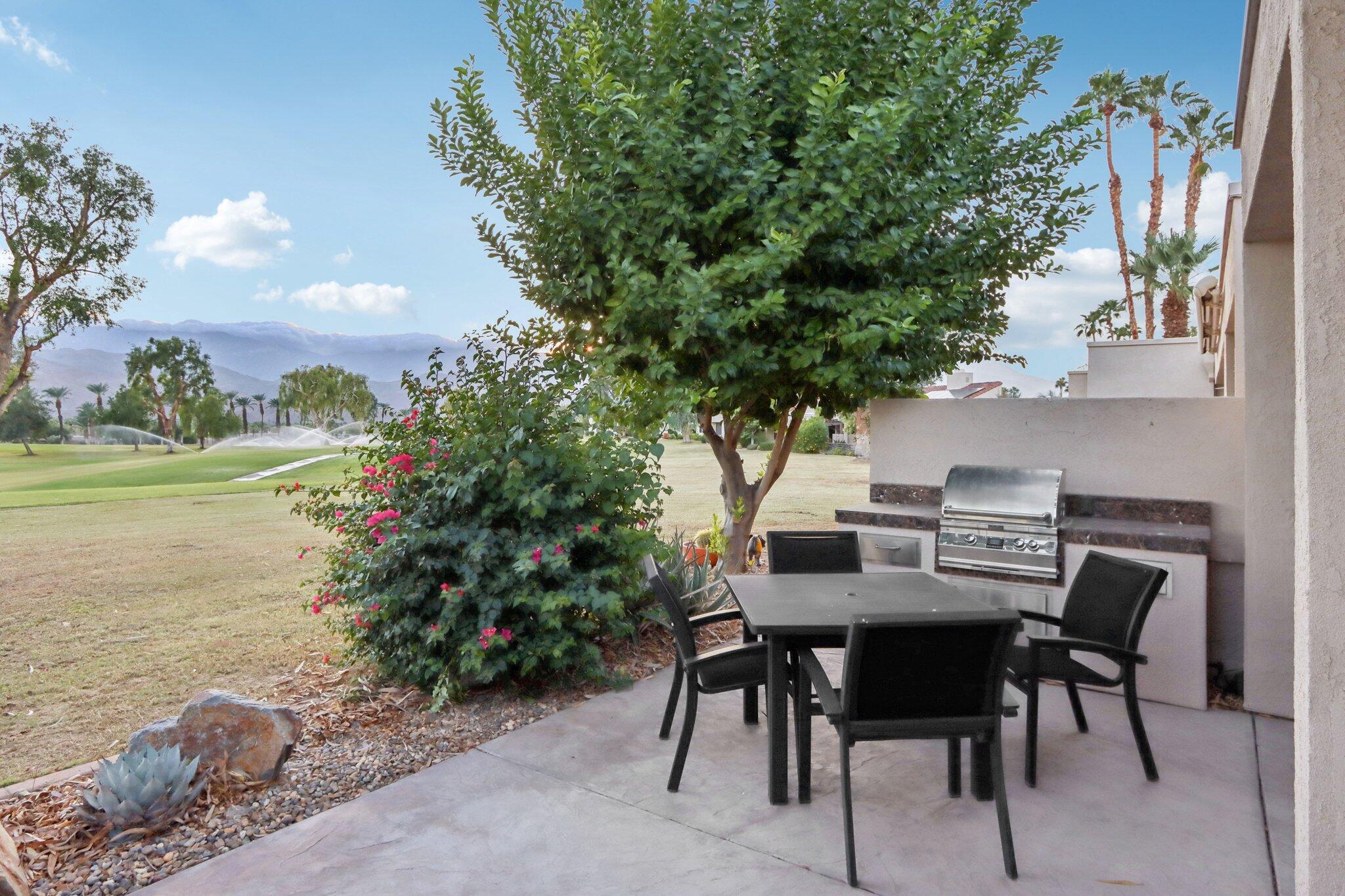 829 Inverness Drive Rancho Mirage, CA 92270 - Photo 26 of 27 a view of an outside dining space with furniture