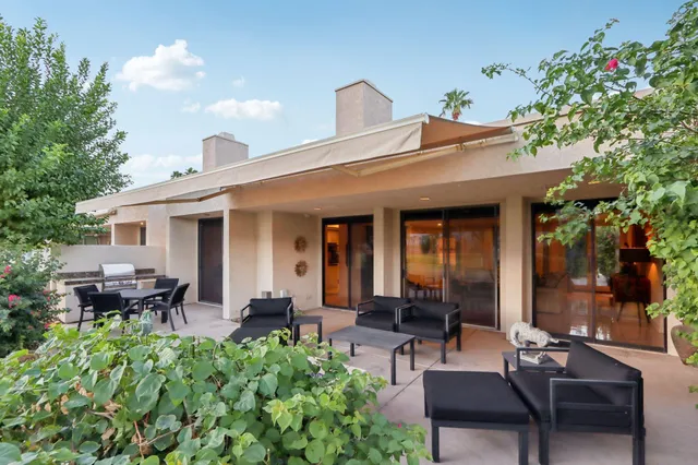 a view of a house with sitting area and furniture