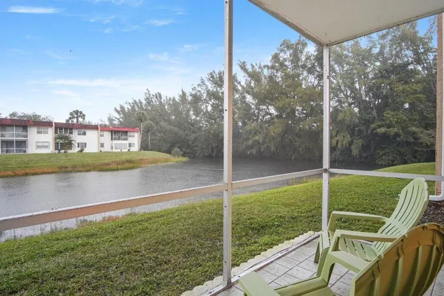 a view of a deck with a big yard