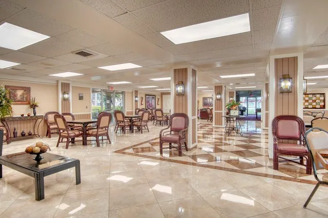a view of a swimming pool with an outdoor seating