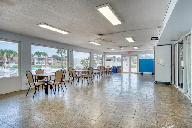 a workspace with a desk chair and painted walls