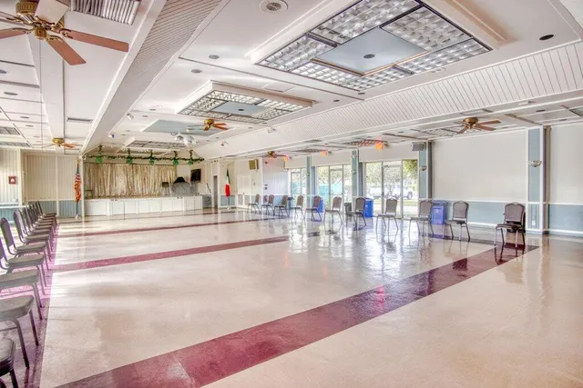 a view of a room with lots of furniture