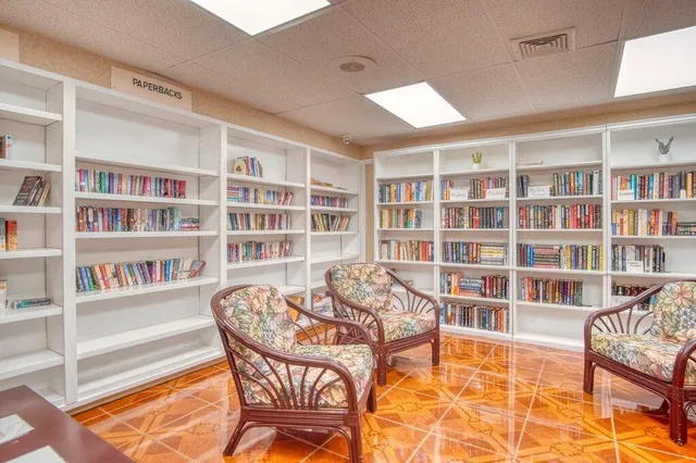a view of a room with lots of dining room and wooden floor