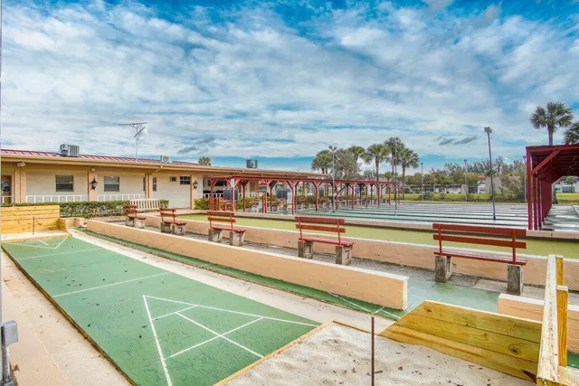 a work room with furniture and a book shelf