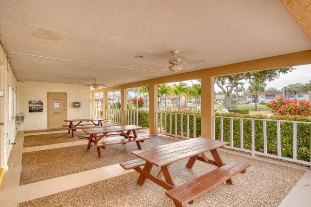 a view of swimming pool with outdoor seating and city view