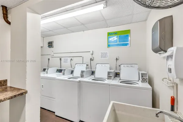 a kitchen with stainless steel appliances a sink and a stove