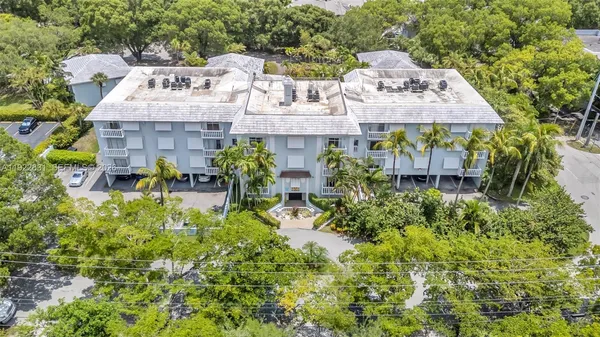 a aerial view of a house with balcony and patio