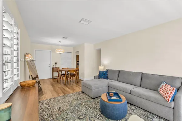 a living room with furniture and a table