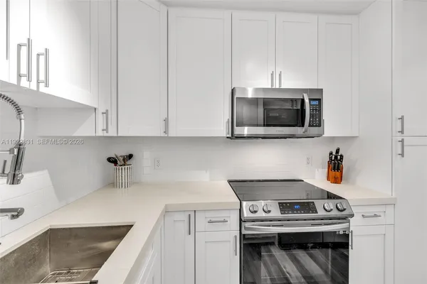 a kitchen with a stove and a microwave