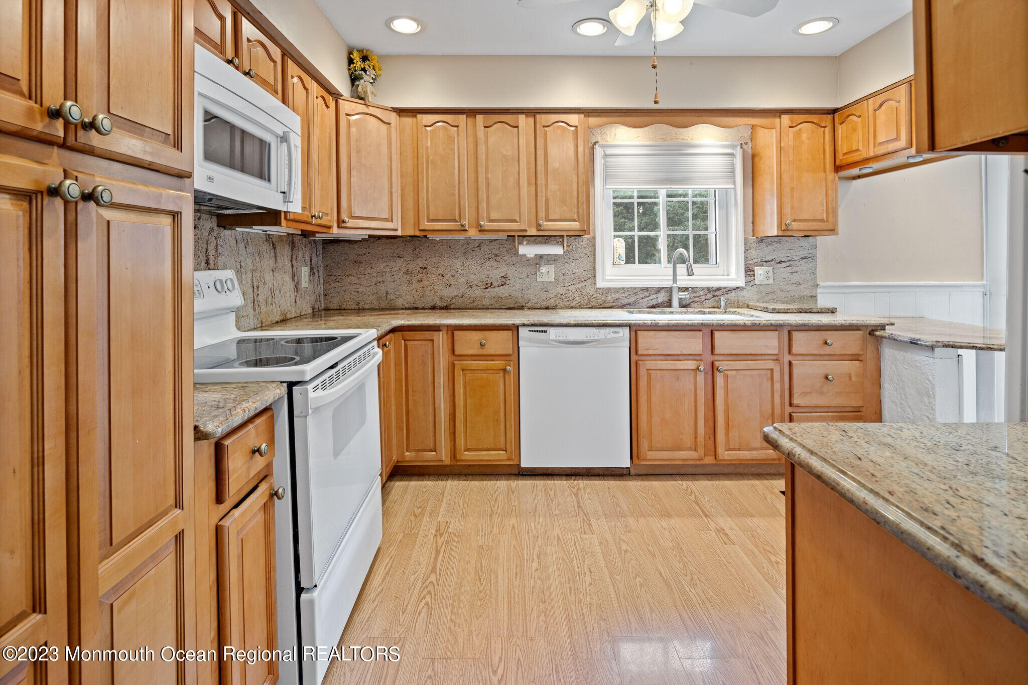187 Torpedo Road Manahawkin, NJ 08050 - Photo 5 of 10 a kitchen with stainless steel appliances granite countertop a stove a sink dishwasher and a refrigerator