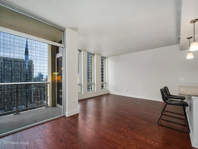 a view of a livingroom with wooden floor