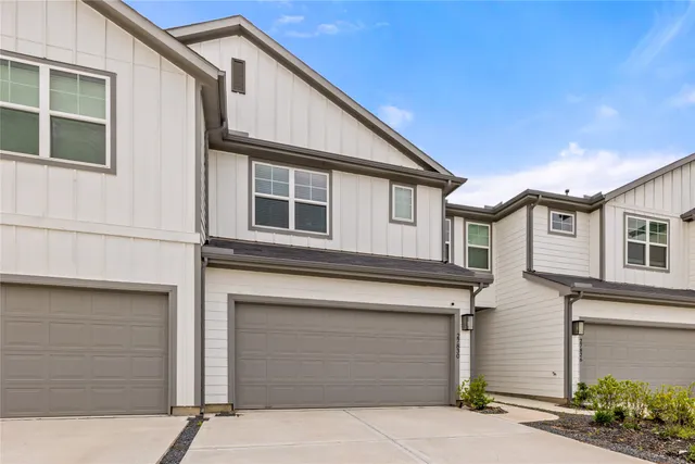 a front view of a house with a garage