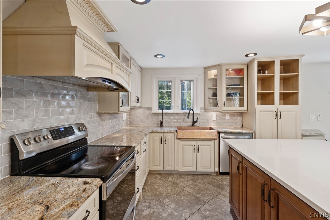 109 Old Powder Mill Road Manlius, NY 13066 - Photo 18 of 47 Close-up of range hood and counters and note brass