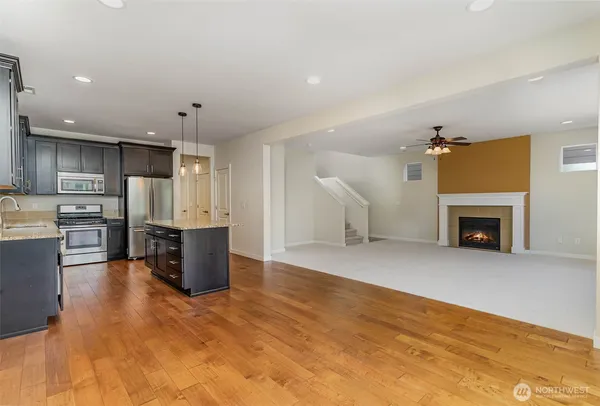 a view of kitchen with furniture and a fireplace