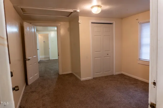 a view of a room with a hallway
