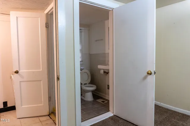 a bathroom with a glass door