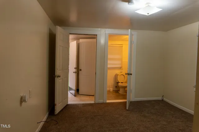 a bathroom with a glass shower door