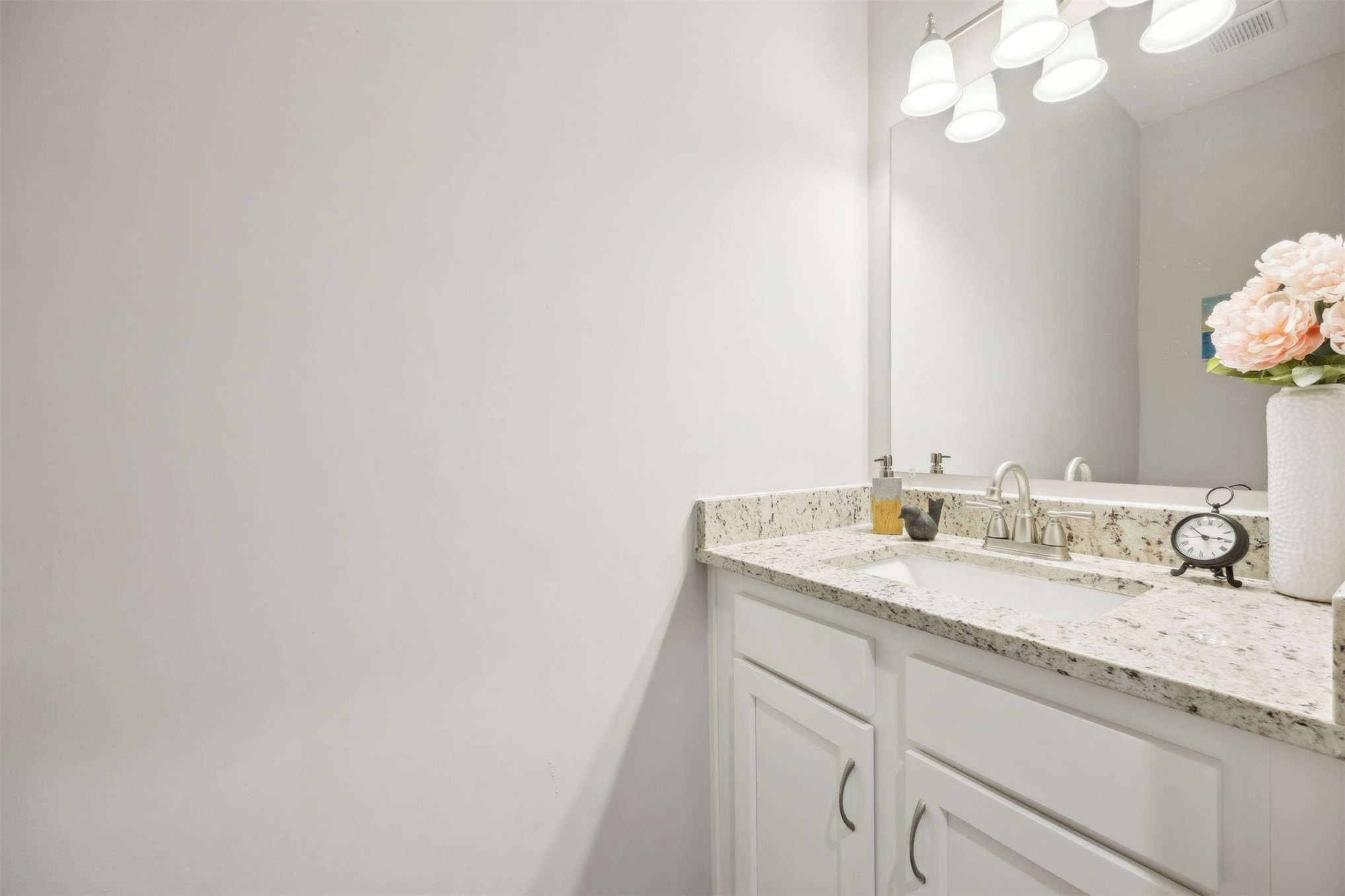 96718 Blackrock Road Yulee, FL 32097 - Photo 45 of 54 a bathroom with a granite countertop sink and a mirror
