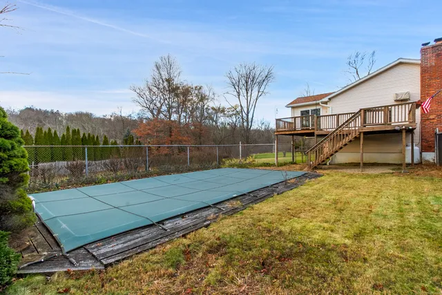 a view of swimming pool with a backyard
